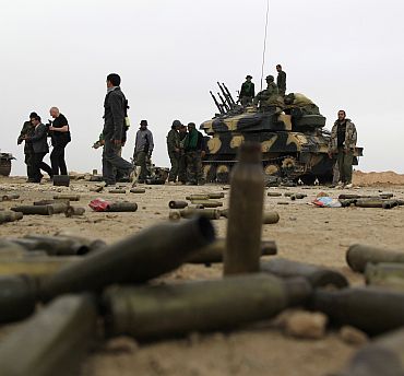 Empty cartridges left near Libyan government soldiers at the west gate of Ajdabiya town