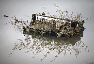 A piano is submerged in water in the area devastated by tsunami in Rikuzentakat
