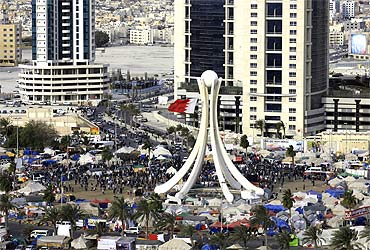 Protesters at Pearl Square as Gulf Cooperation Council forces move in to evacuate the area