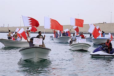 Anti-government fishermen protest in their boats around the shore of Manama