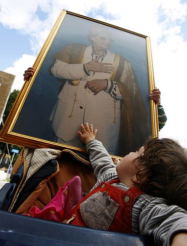 Supporters of Libyan leader Muammar Gaddafi protest over the air strikes against Libya by a coalition of Western countries outside the French and US embassies in Nicosia, Cyprus