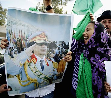A supporter of Libya's leader Muammar Gaddafi shouts during a protest in Tripoli