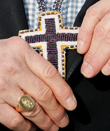 Primate of Anglican Church of Canada Most Revd Sandford Hutchison displays crucifix in Ireland