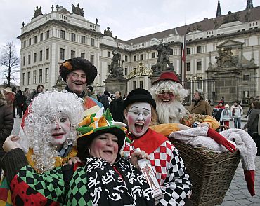 Revellers in fancy dress parade in front of Prague Castle in Prague, capital of Czech Republic