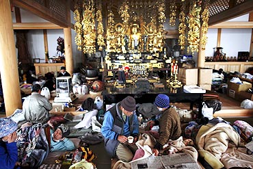 Tsunami victims find shelter in a Buddhist temple in Kesennum