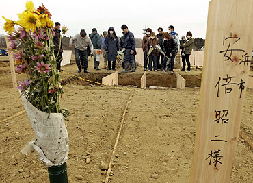 Bereaved family members of victims of the earthquake and tsunami