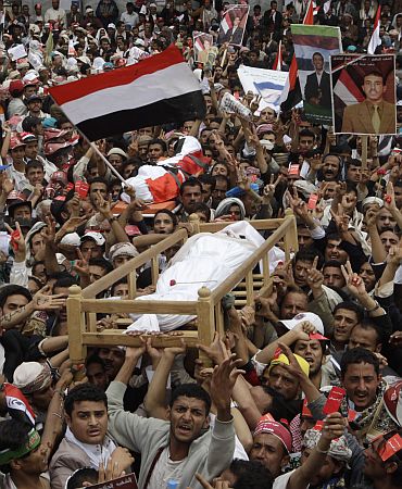 Anti-government protesters, demanding the resignation of Yemeni President Saleh, during funeral procession in Sanaa University on Friday