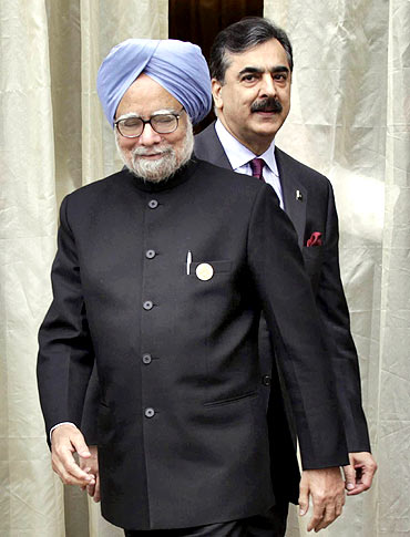 Dr Singh with Prime Minister Yusuf Raza Gilani