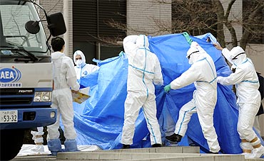 Japan Self Defence Force members prepare to transfer to another hospital workers who were exposed to radiation at Tokyo Electric Power Co's Fukushima Daiichi Nuclear Power Plant