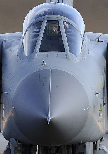 The pilot of a Royal Air Force Tornado jet taxis along the runway at RAF Lossiemouth in Moray, northern Scotland
