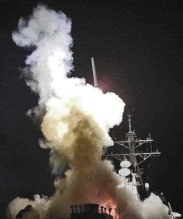 The USS Barry launches a Tomahawk missile during Operation Odyssey Dawn in the Mediterranean Sea