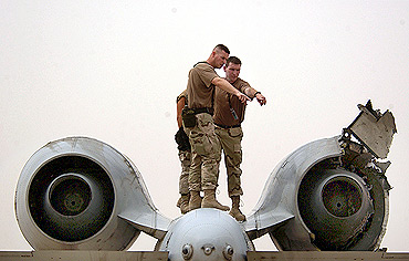 Workers with an A-10 maintenance crew