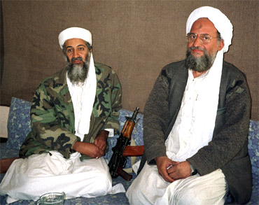 Osama bin Laden sits with Ayman al-Zawahiri
