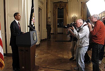 Photographers take pictures of US President Barack Obama after he announced Laden's death