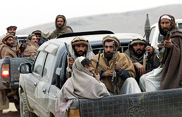 Afghan fighters in the Tora Bora mountains, December 16, 2001. Laden was believed to have escaped into Pakistan's tribal areas through this area of Afghanistan