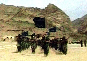 Recruits of Osama bin Laden are seen marching in this frame grab from an undated training video at an undisclosed location in Afghanistan