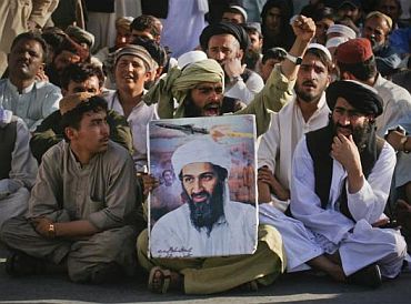 Supporters of al-Qaeda leader Osama bin Laden shout anti-American slogans, after the news of his death, during a rally in Quetta