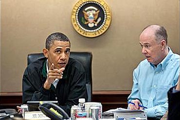Obama discusses the operation with US National Security Advisor Tom Donilon at the White House