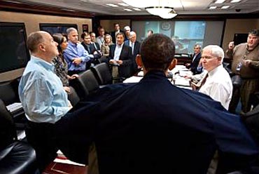 Obama talks with members of the national security team at the conclusion of one in a series of meetings discussing the mission against Osama bin Laden, in the Situation Room of the White House