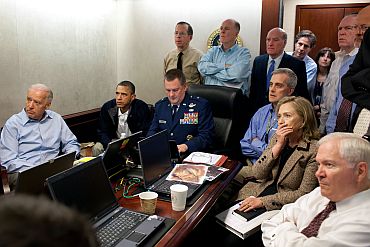 President Barack Obama and Vice President Joe Biden, along with members of the national security team, receive an update on the mission against Osama bin Laden in the Situation Room of the White House
