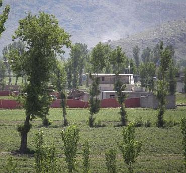 Surrounded in red fabric, a compound is seen where locals reported a firefight took place overnight in Abbotabad