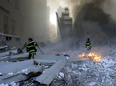 Firemen work around the World Trade Center after both towers collapsed in New York on September 11, 2001, in a terror attack