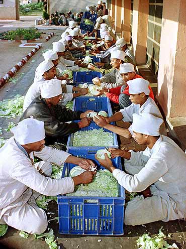 Inmates at New Delhi's Tihar jail, one of the world's largest prisons, prepare food