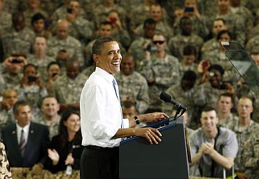 President Obama smiles as he arrives to speak to troops at Fort Campbell in Kentucky
