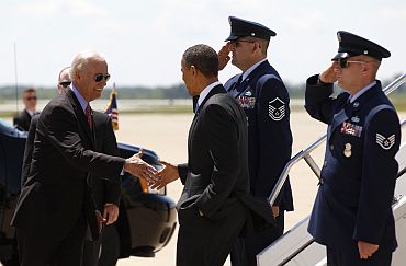 President Obama is greeted by Vice President Joe Biden as he arrives to speak to troops at Fort Campbell in Kentucky