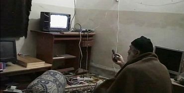 Osama bin Laden is shown watching himself on television in this video frame grab released by the US Pentagon