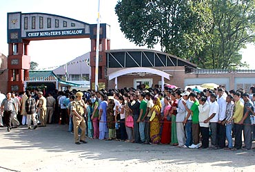 Supporters stand in a queue to pay their respects to the body of Dorjee Khandu