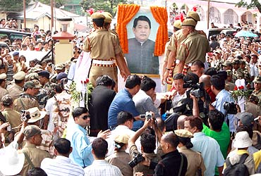 Supporters follow the body of Dorjee Khandu