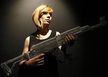 A model presents a creation by Nicola Bolla made from Swarovski crystals during Milan Design Week. The creation is part of Bolla's installation of 15 sculptures in Swarovski crystals called Ossuary