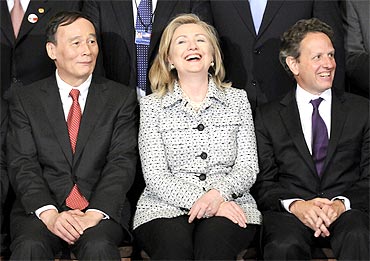 China's Vice Premier Wang Qishan (L-R), US Secretary of State Hillary Clinton and US Treasury Secretary Timothy Geithner gather for a portrait