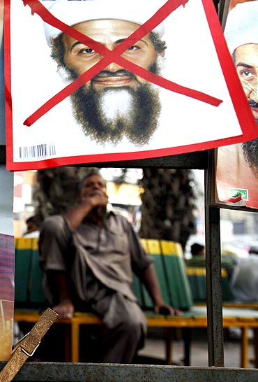 A newspaper stand displays magazines with pictures of Al Qaeda's Osama bin Laden