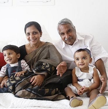 With wife Mariamma Oommen and grandchildren