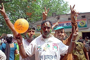 Trinamool Congress supporters celebrate after their party won the assembly elections in West Bengal