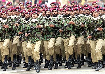 Pakistani army commandos participate in the National Day parade in Islamabad