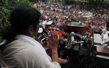 Banerjee waves to crowds from Writers' Building