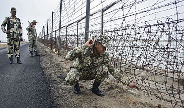 BSF soldiers patrol along the border with Pakistan in Banaskanth district, Gujarat