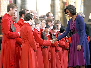 Obama greets members of the choir at Westminster Abbey