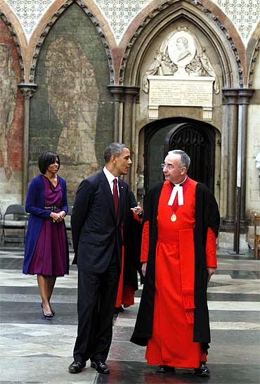 The Obamas are escorted around Westminster Abbey by the Dean of Westminster Dr John Hall