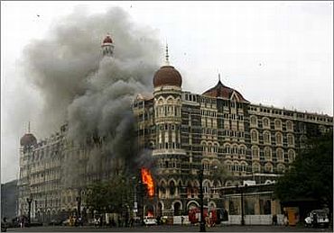 A burning Taj Mahal Hotel in Mumbai during 26/11 terror attacks