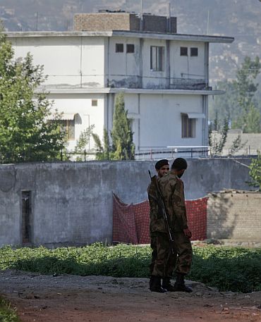 Soldiers keep guard around a compound within which Al Qaeda leader Osama bin Laden was killed in Abbottabad, Pakistan