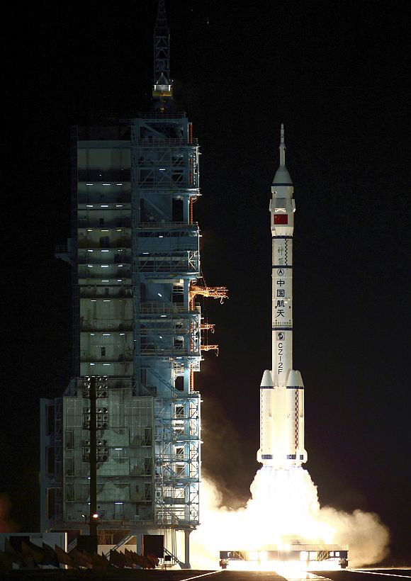 A Long March CZ-2F rocket carrying the unmanned spacecraft Shenzhou 8 blasts off from the launch pad at the Jiuquan Satellite Launch Center
