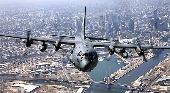 A Royal Australian Airforce C-130 Hercules flies over Melbourne