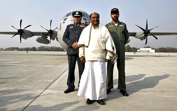 Defence Minister AK Antony, Air Chief Marshal PV Naik and Tejvir Singh, an Air Force official, pose in front of the C-130J-30 Super Hercules aircraft