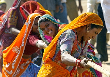 Rajasthani women take part in tug of war game at Pushkar fair