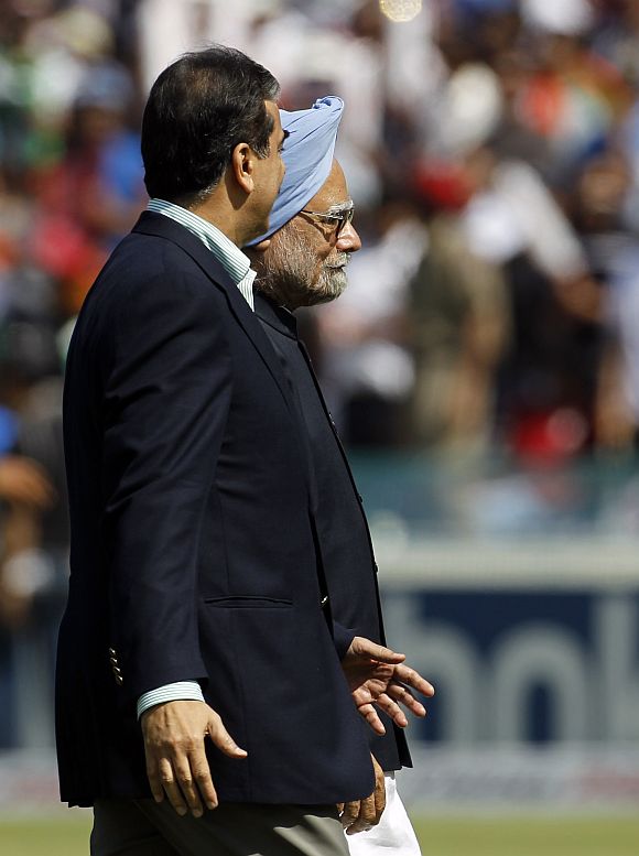 Dr Manmohan Singh and Pakistan's Prime Minister Yusuf Raza Gilani walk together ahead of the ICC Cricket World Cup semi-final match between their countries in Mohali in this picture taken on March 30, 2011.