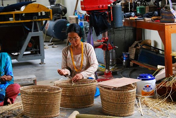 An Arunachali women busy making cane baskets
